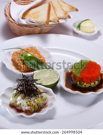 Sea food restaurant appetizers with flying fish caviar and sea food.