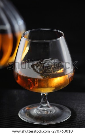 Whiskey on the rocks, whiskey glass, whiskey bottle