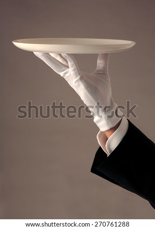 https://image.shutterstock.com/display_pic_with_logo/1090928/270761288/stock-photo-waiter-s-hand-in-white-glove-holding-a-tray-white-glove-service-270761288.jpg
