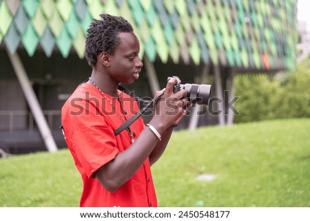 Similar – Image, Stock Photo Man shooting building facade with smartphone in downtown