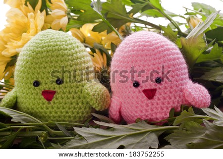 handmade chick with spring flowers as decoration