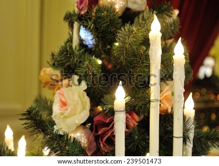 MOSCOW - DECEMBER 21: Close-up of Christmas tree, electric candles and ornaments inside GUM store on December 21, 2014 in Moscow.