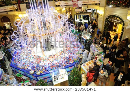 MOSCOW - DECEMBER 21: Christmas fair, illumination and buyers in GUM store on December 21, 2014 in Moscow.