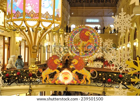 MOSCOW - DECEMBER 21: Drawn lions, snowflakes and Christmas illuminations in GUM store on December 21, 2014 in Moscow.