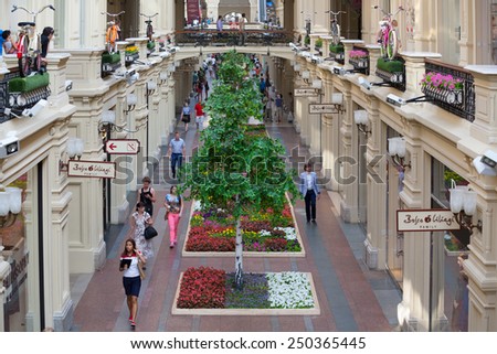MOSCOW - JULY 29: Artificial trees and balconies decorated bicycles in the GUM store on July 29, 2014 in Moscow. GUM is the large store in the Kitai-gorod part of Moscow facing Red Square.