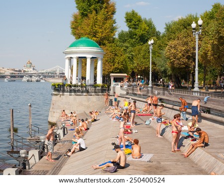 MOSCOW - JULY 31: People relaxing at Olive Beach on Moscow River on July 31, 2014 in Moscow. Olive Beach is located in Gorky Park.