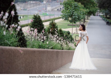 Beautiful delicate bride enjoying her wedding day in Paris
