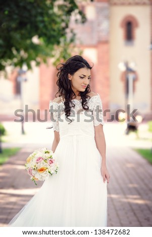 Beautiful delicate bride enjoying her wedding day