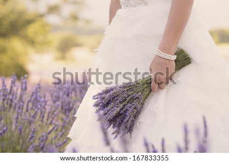 Bride\'s bouquet in a lavender field