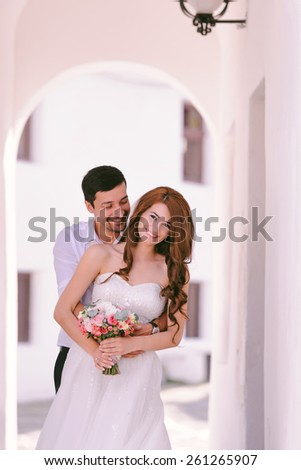 Bride and groom laughing on their wedding day