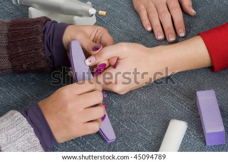 A nail designerin at work