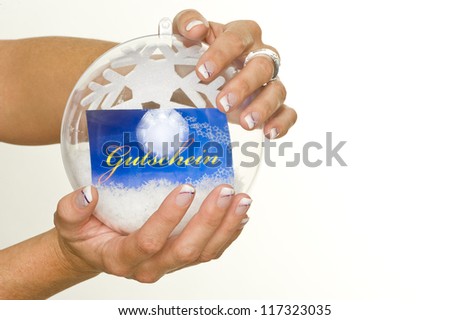 beautiful hands with fresh manicured nails holding a crystal ball