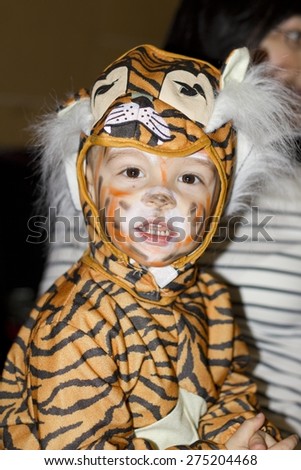 Young boy in a tiger costume. Photo taken on: February 28ST, 2015
