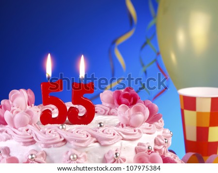 Birthday-anniversary cake with red candles showing Nr. 55