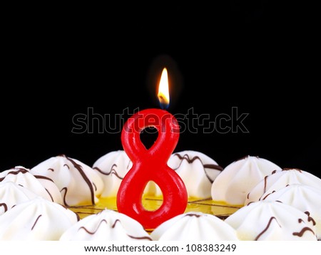 Birthday-anniversary cake with red candles showing Nr. 8