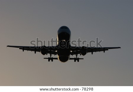 Boeing 767 on final approach at dusk