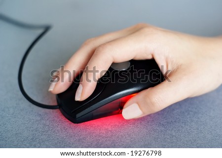 female hand using computer mouse