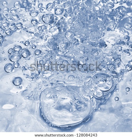 Surface of intensive boiling water with bubbles and swirls