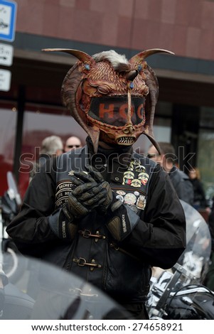 RIGA, LATVIA - APR 26: Biker season opening party participant shows his suit on Apr 26, 2015 in Riga, Latvia. Party is held annually uniting more than 4,000 members
