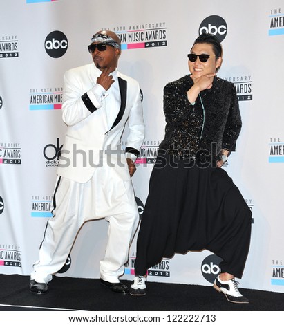 LOS ANGELES, CA - NOVEMBER 18, 2012: MC Hammer & Psy (right) at the 40th Anniversary American Music Awards at the Nokia Theatre L.A. Live.