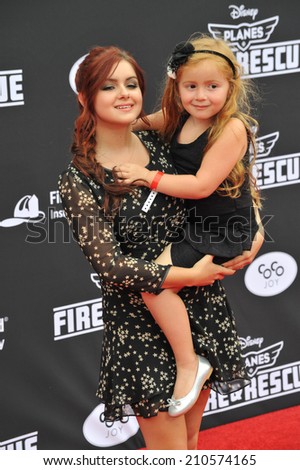 LOS ANGELES, CA - JULY 15, 2014: Ariel Winter & niece at the world premiere of Disney\'s \