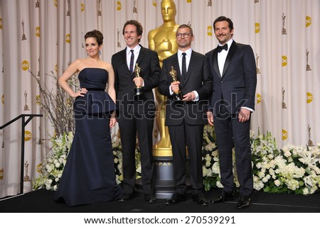 LOS ANGELES, CA - FEBRUARY 26, 2012: Kirk Baxter & Angus Wall, winner for Best Film Editing for The Girl With The Dragon Tattoo, with presenters Tina Fey & Bradley Cooper at the 82nd Academy Awards.