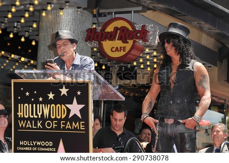 LOS ANGELES, CA - JULY 10, 2012: Rock guitarist Slash & actor Charlie Sheen on Hollywood Blvd where he was honored with a star on the Hollywood Walk of Fame.