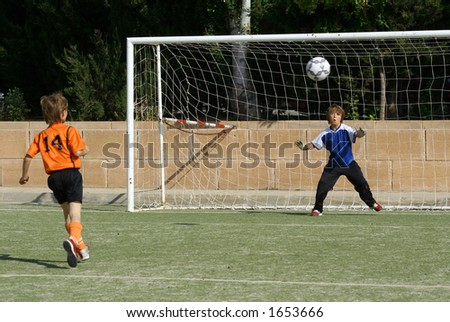 footballer shooting at goal