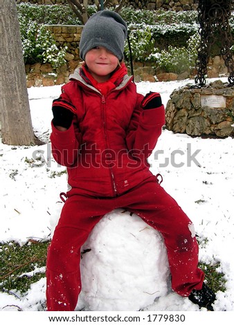 Young boy having the greatest of fun in the snow