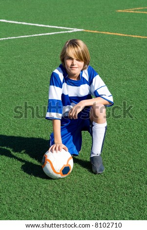 typical portrait of young soccer boy(all logos patterns removed or altered)