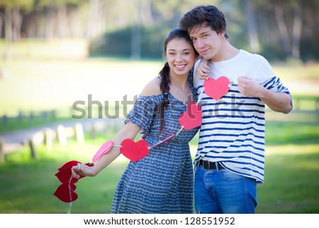 happy loving valentines day couple with valentine hearts