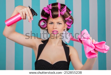 stressed retro woman in rollers multitasking spring cleaning