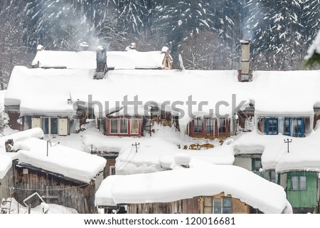 Houses snowy and frozen in a mountain resort, Romania/Ice houses/