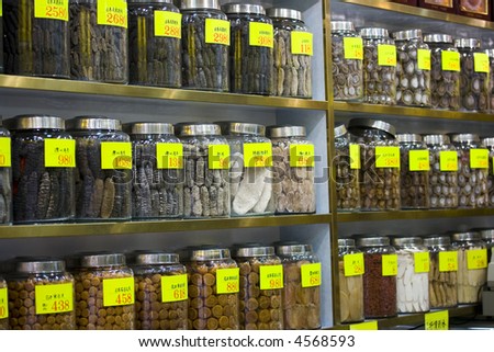 Rows of chinese herbal medicines on shelves