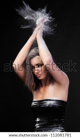 Beautiful Woman Clapping White Powder Over Her Head
