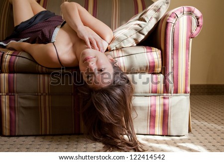Pretty Woman Lying Upside Down on Couch