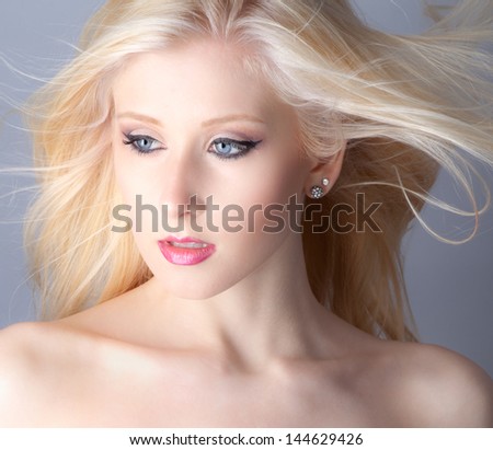 Close Up of Pretty Teen With Makeup and Blowing Hair