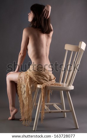 Gorgeous Implied Woman in Chair