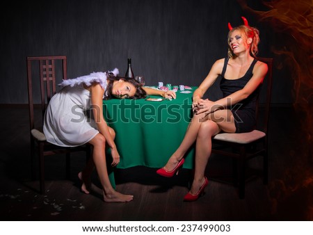 Angel and devil with drugs in dark room