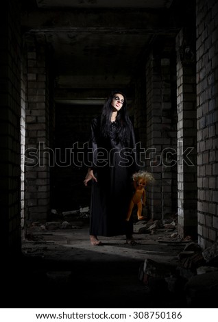 Scary zombie girl in old house