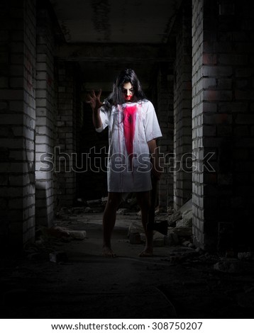 Scary zombie girl in old house