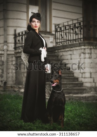 Young woman in ancient costume with dog (ancient version)
