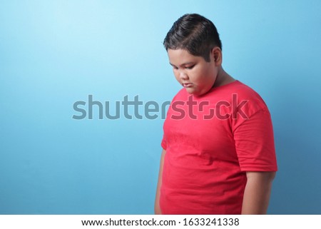 Similar – Image, Stock Photo Sad boy looking down in studio