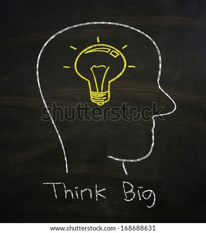 Think Big Concept, drawn with Chalk on Blackboard