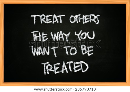 The words Treat others the way you want to be treated written with chalk on blackboard