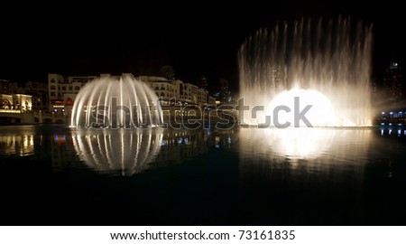 DUBAI, UAE - FEB 19: A record-setting fountain system set on Burj Khalifa Lake. Illuminated by 6600 lights and 25 projectors, it shoots water 150 m into the air. Taken on February 19, 2011 in Dubai.