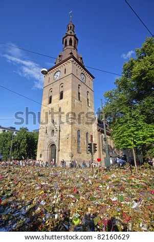 OSLO-JULY 31: People lay down flowers and lights candles outside the cathedral of Oslo to show respect for the victims of the bombing and shooting that took place July 22 2011, July 31 2011, Oslo