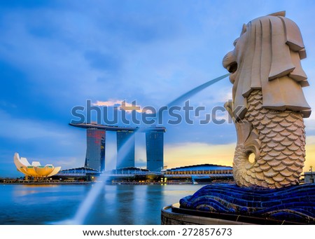 SINGAPORE-APRIL 23: The Merlion fountain and Marina Bay Sands on April  23, 2012. Merlion is an imaginary creature with a head of a lion and the body of a fish and is seen as a symbol of Singapore.