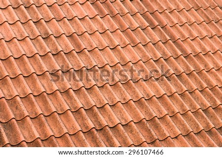 Old red roof tiles closeup