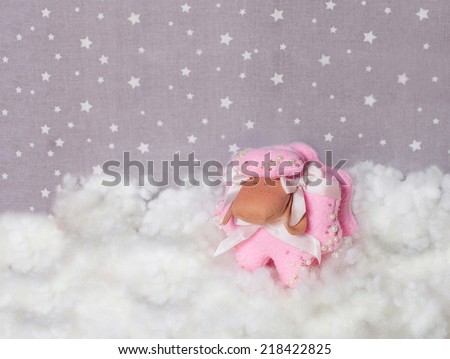 symbol of 2015 handmade sheep in the clouds,  textile background with stars